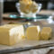 Sliced butter on kitchen counter.