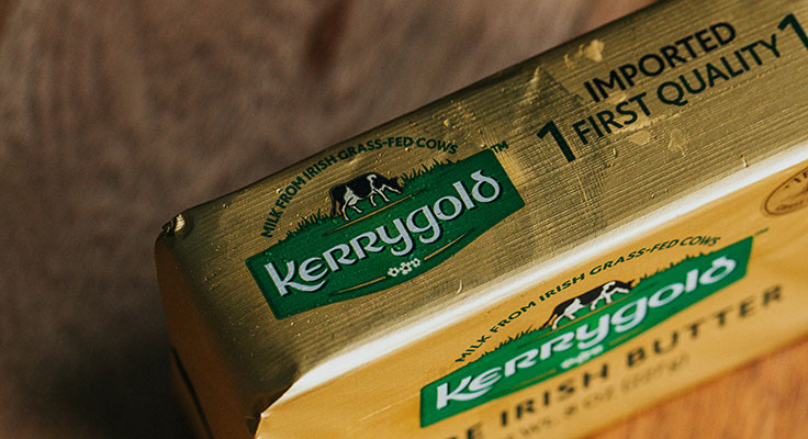 Kerrygold butter package on wooden surface.