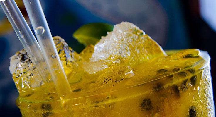Close-up of iced passion fruit drink.
