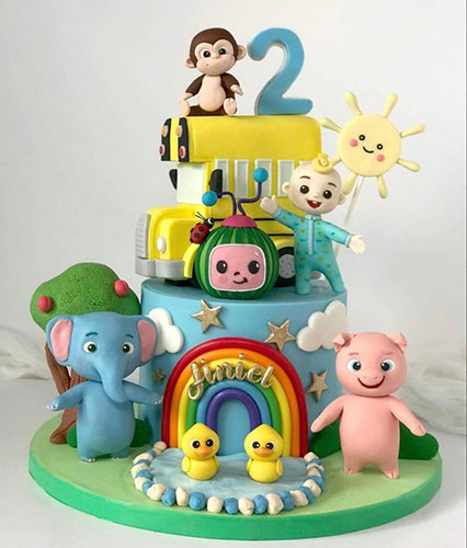 Colorful animal-themed second birthday cake