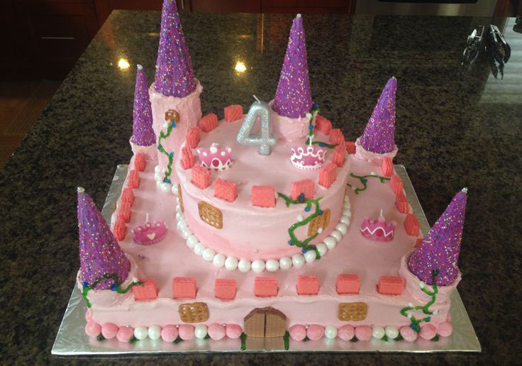 Pink castle-themed birthday cake for a 4-year-old.