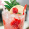 Refreshing raspberry lemonade cocktail with mint garnish.