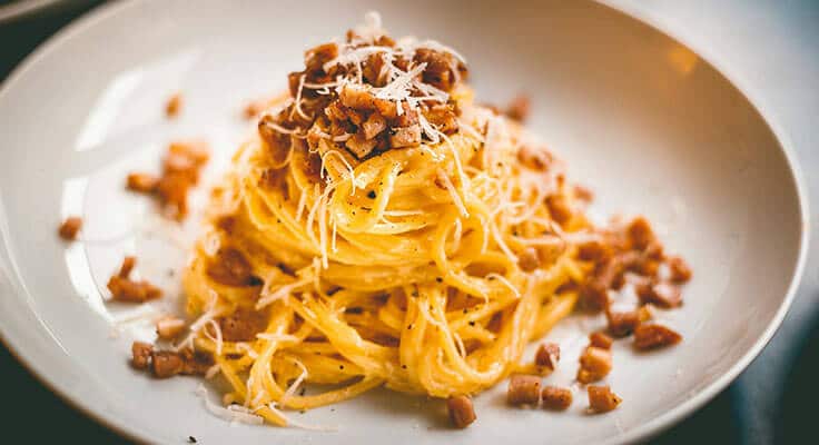 Creamy pasta with cheese and bacon bits.