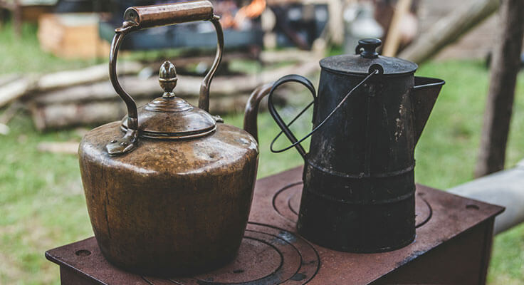 Vintage kettle and coffee pot outdoors.