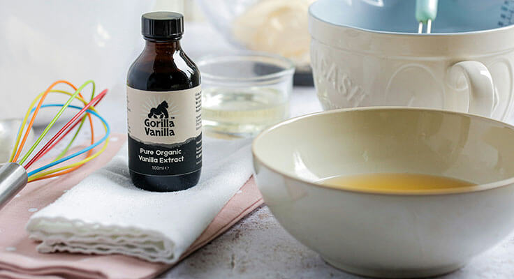 Organic vanilla extract bottle with baking ingredients.