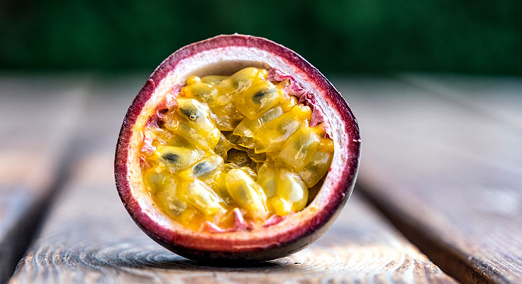 Fresh passion fruit on wooden table.