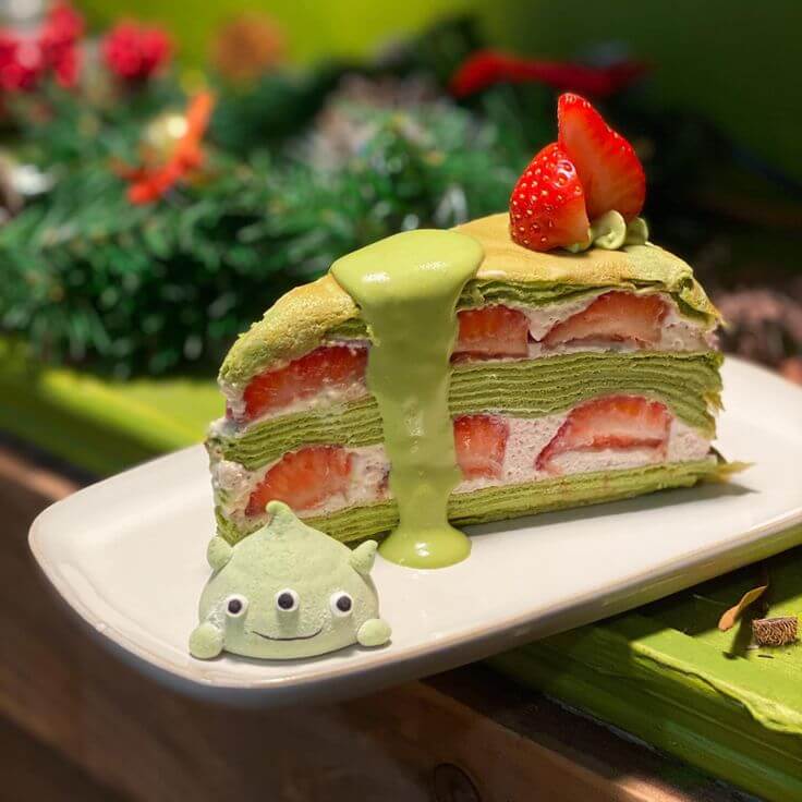 Matcha strawberry mille-feuille dessert on plate.