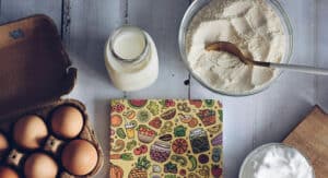 Baking ingredients on wooden table, recipe preparation.
