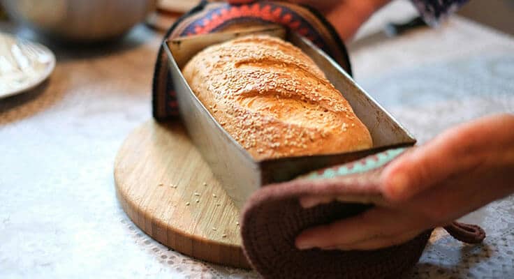 Freshly baked bread in loaf pan.