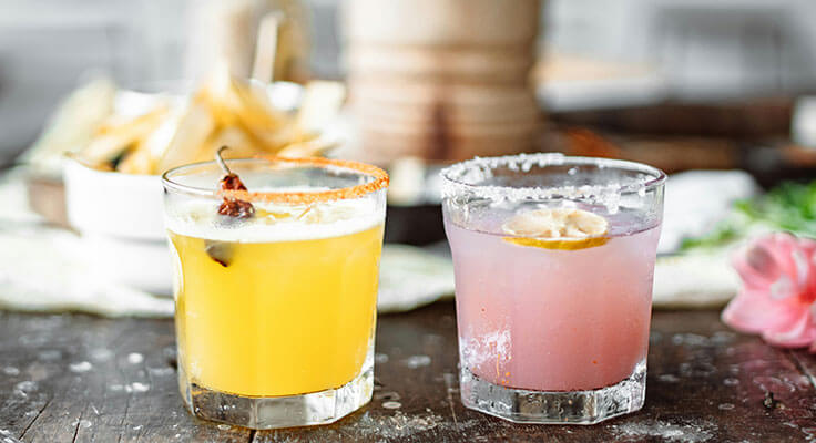 two glasses with different vanilla vodka drinks