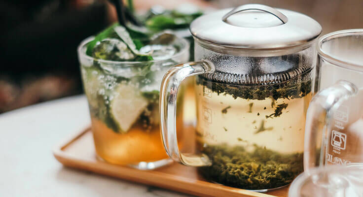 peppermint tea in a glass on a tablet