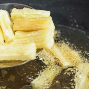 putting fries into vegetable oil