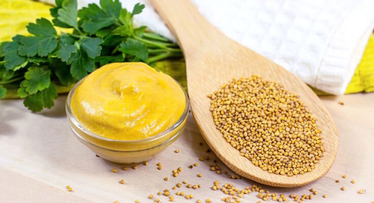 Mustard paste and seeds with parsley.