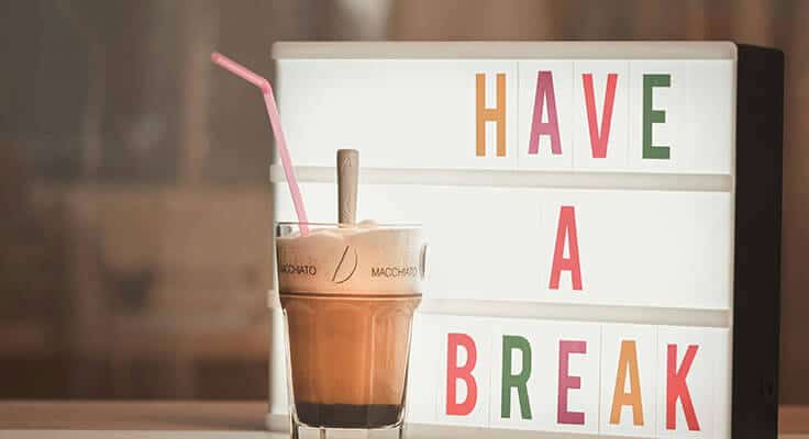 Iced coffee with 'Have a break' sign.