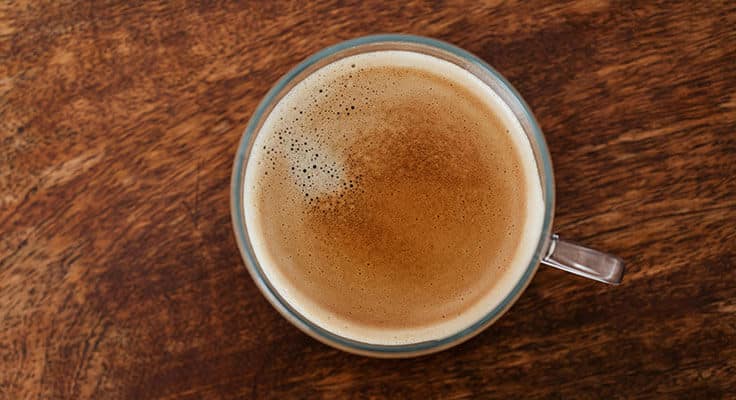 Cup of coffee on wooden table