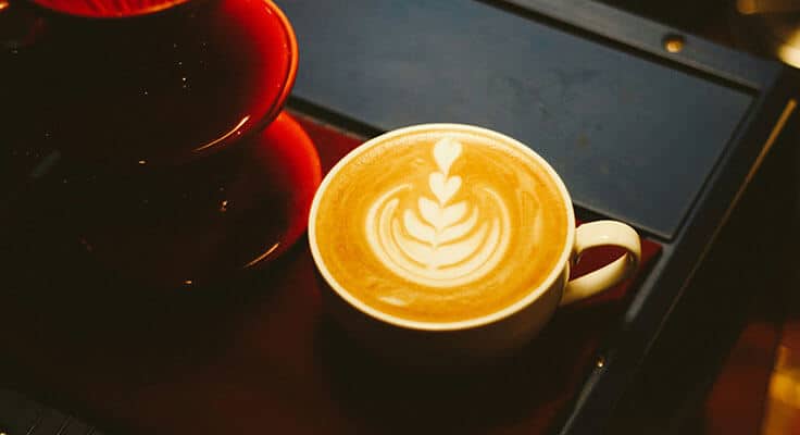 Latte art coffee in white cup