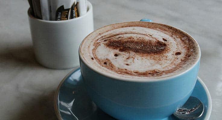 Cup of hot chocolate on table