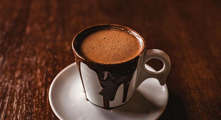 Cup of hot chocolate on table