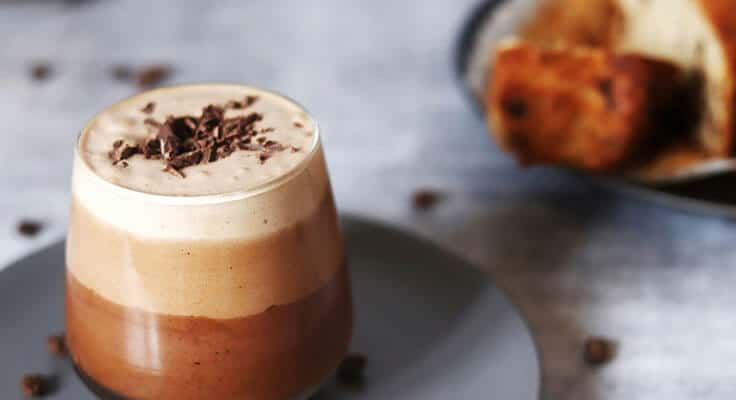 Chocolate mousse dessert with chocolate shavings.