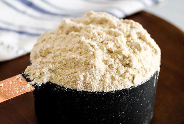 Measuring cup filled with flour