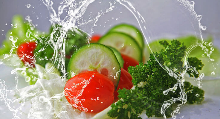 Fresh vegetables with water splashes