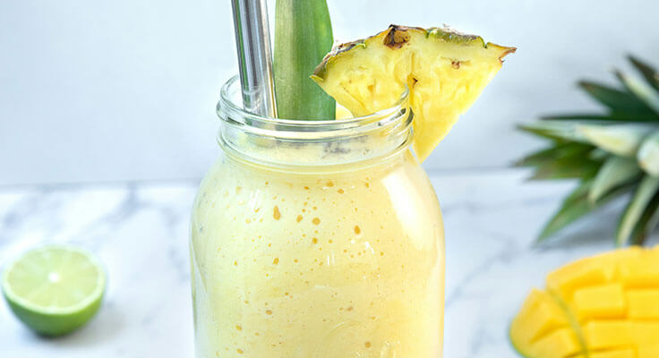 Pineapple smoothie in a jar.