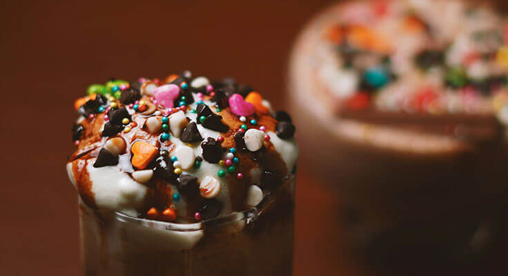 Chocolate milkshake with colorful sprinkles toppings
