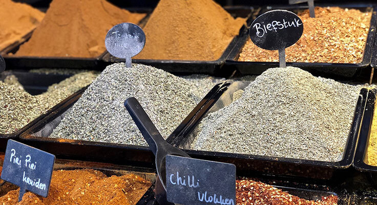 Various spices displayed in a market stall.