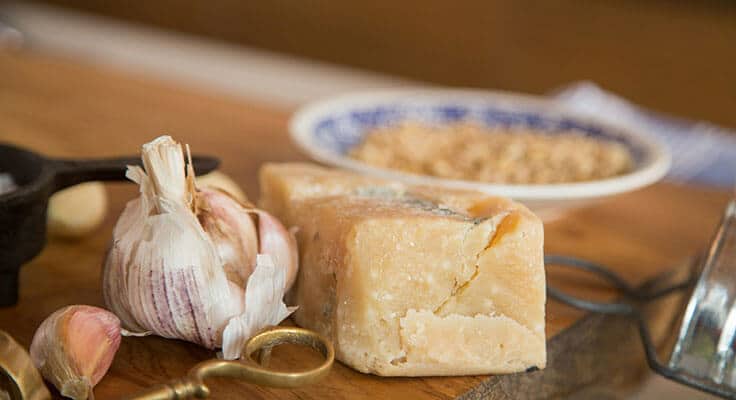 Garlic and cheese on cutting board