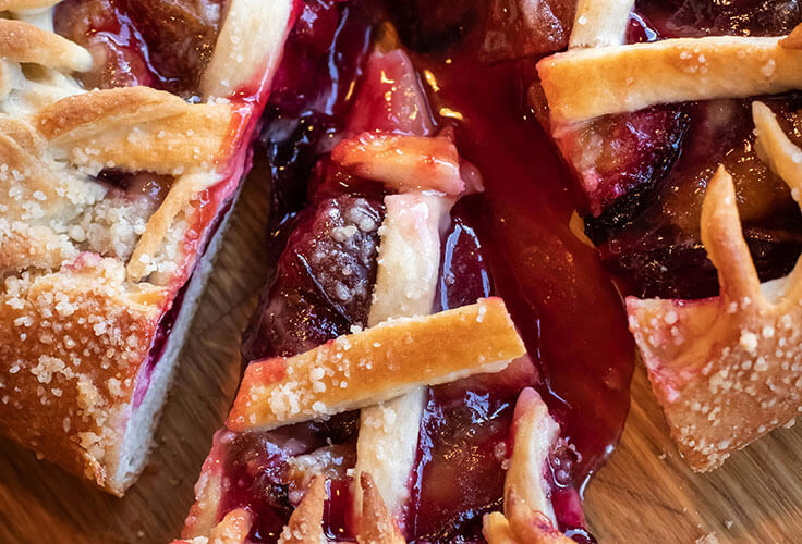 Close-up of delicious fruit tart slice.