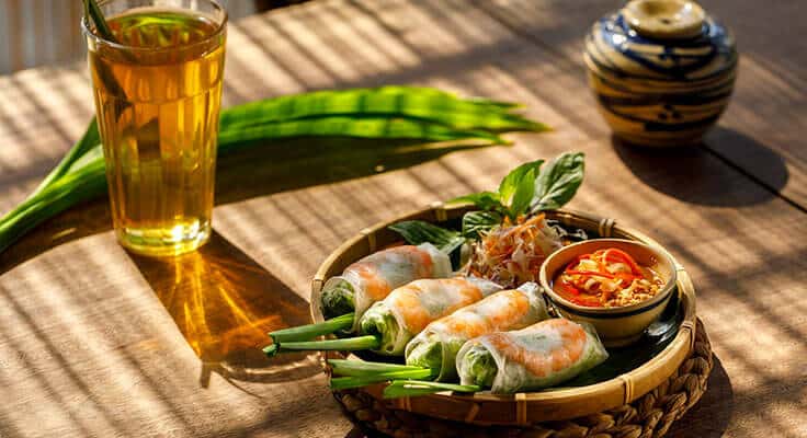 Vietnamese spring rolls with tea and sauce